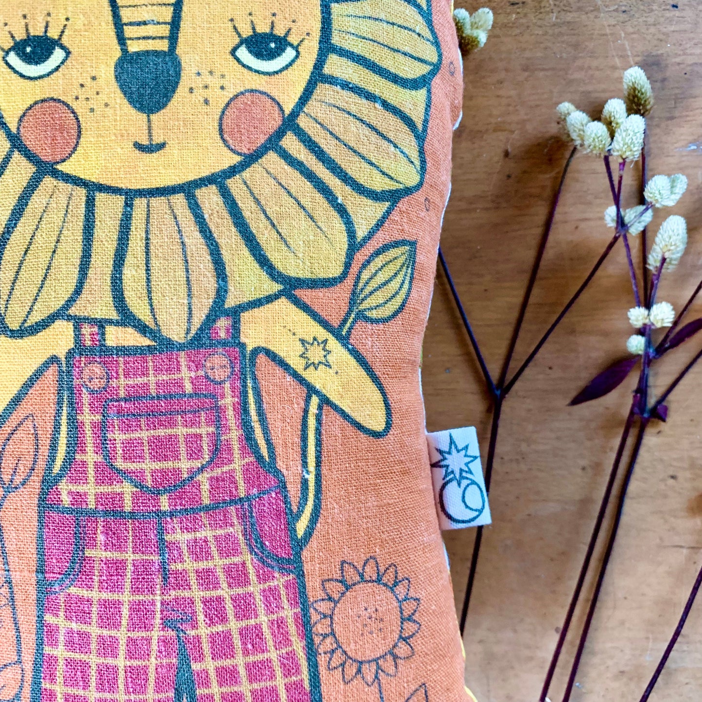Dandy lion earthy rust linen cushion