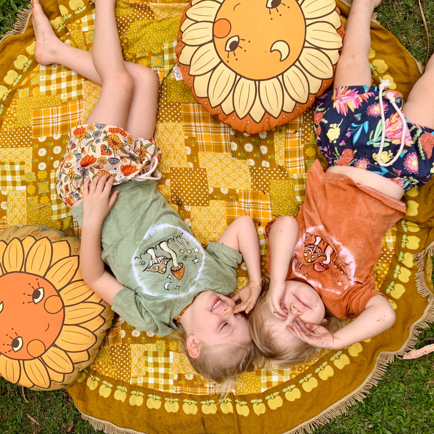 Sunflower face round organic canvas cushion in sunshine