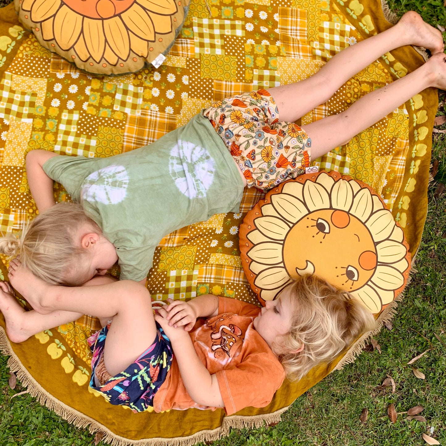 Sunflower face round organic canvas cushion in sunshine